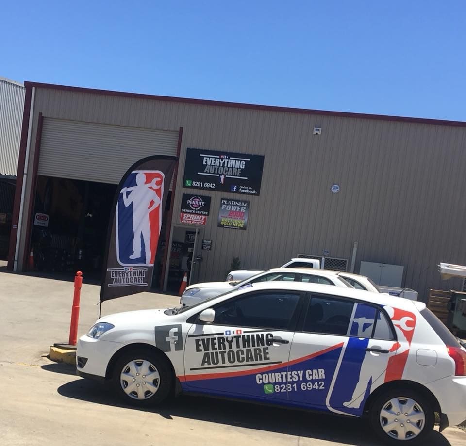 The white Everything Autocare courtesy car parked outside the workshop
